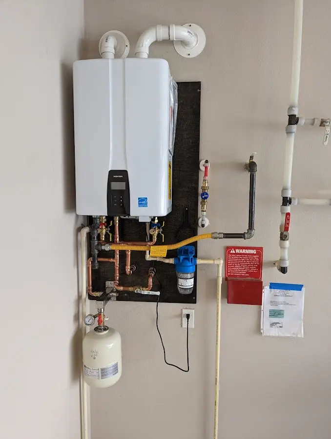 Professional plumber installing copper piping in a Palmyra home